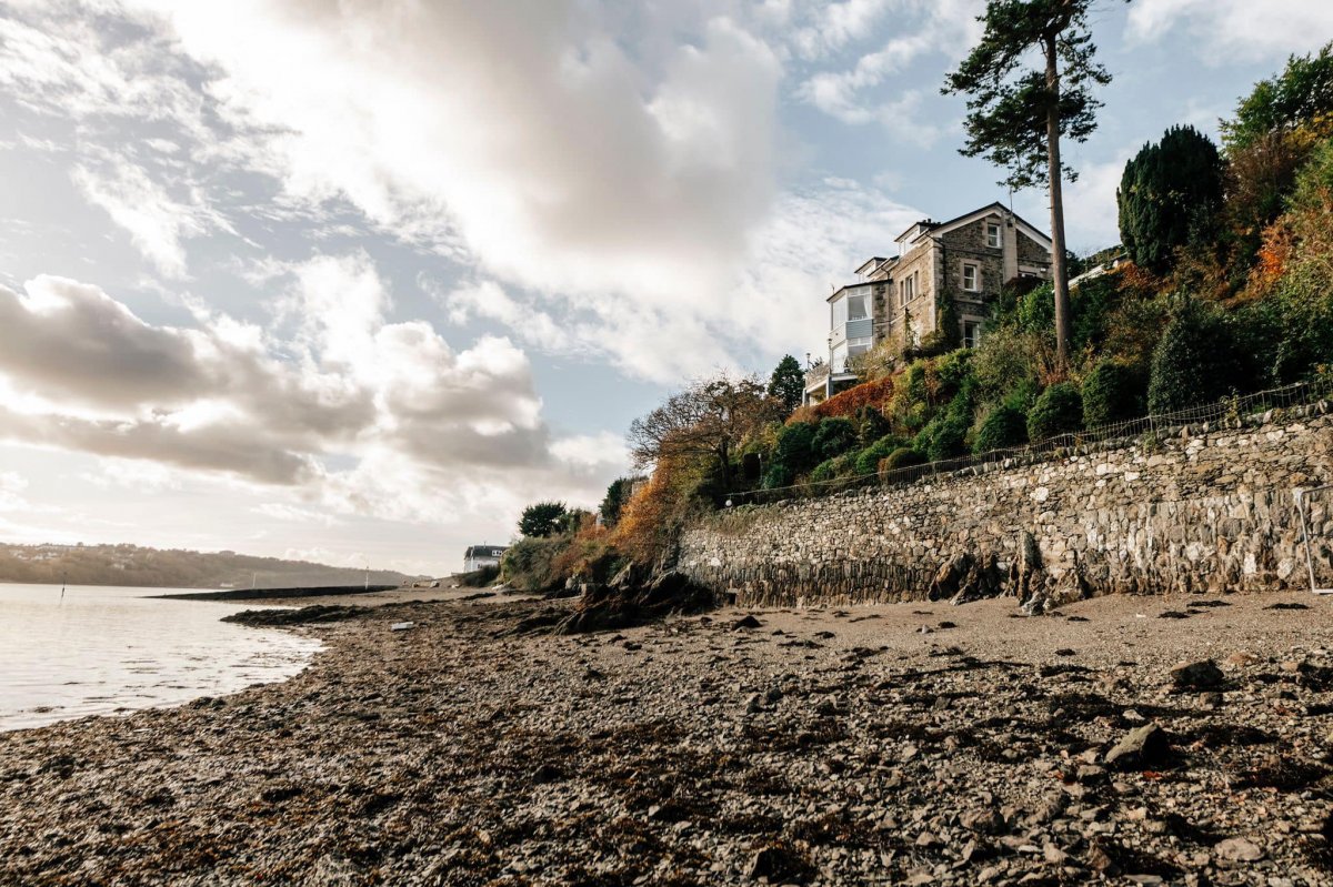 This unique house stands alone in grounds and beach setting